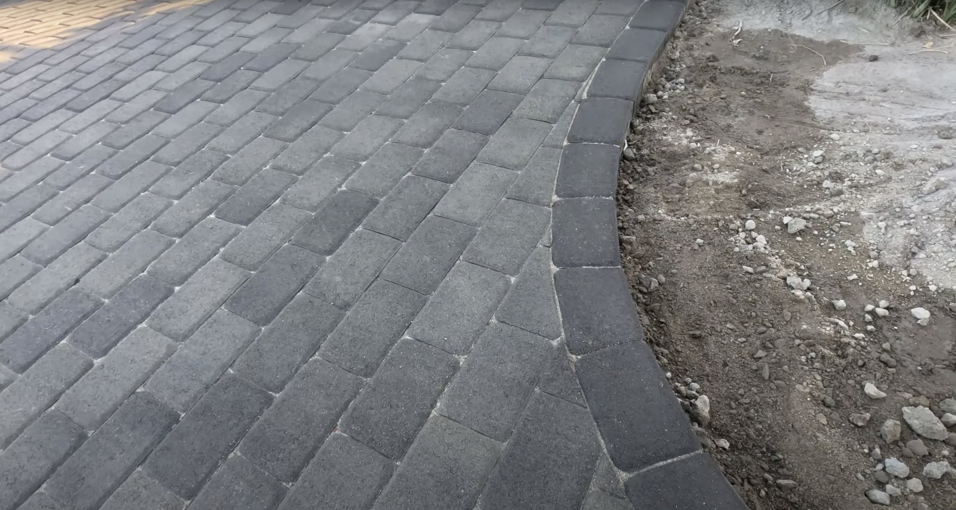 High-quality concrete paver driveway installation with professional edge work