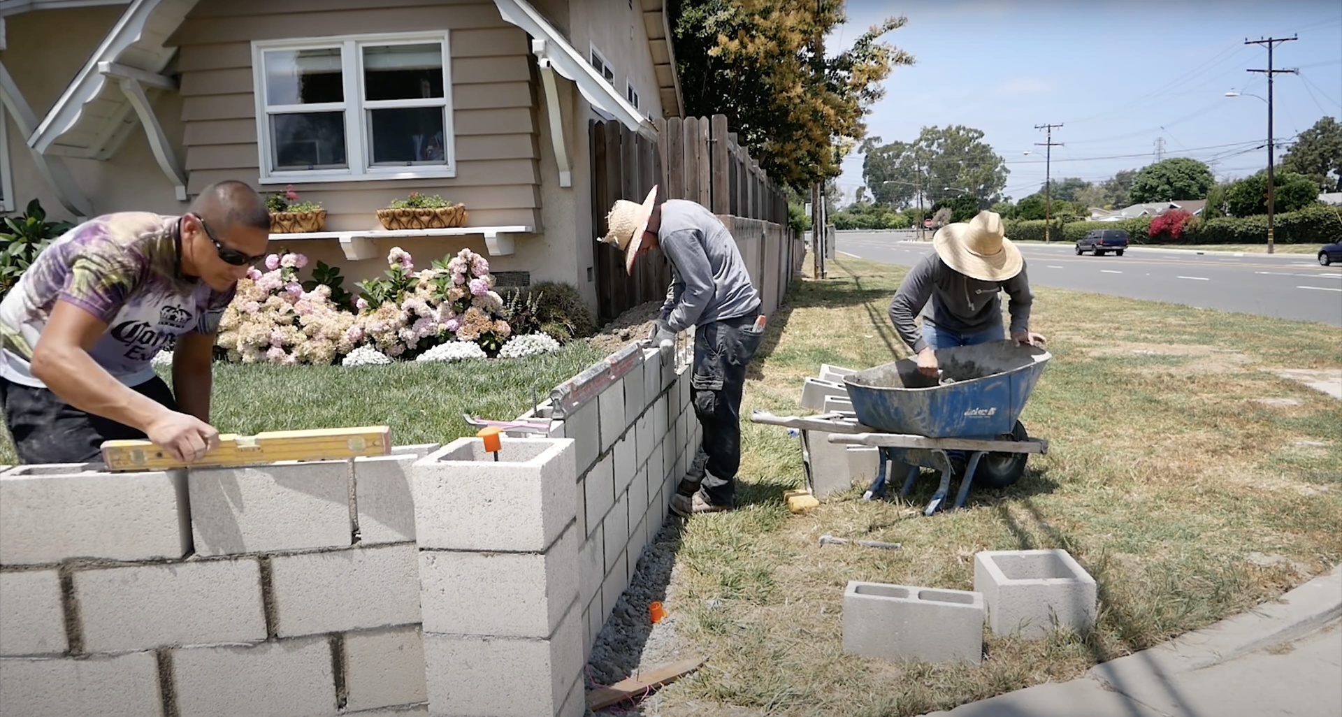 Concrete block wall construction team working on residential foundation project