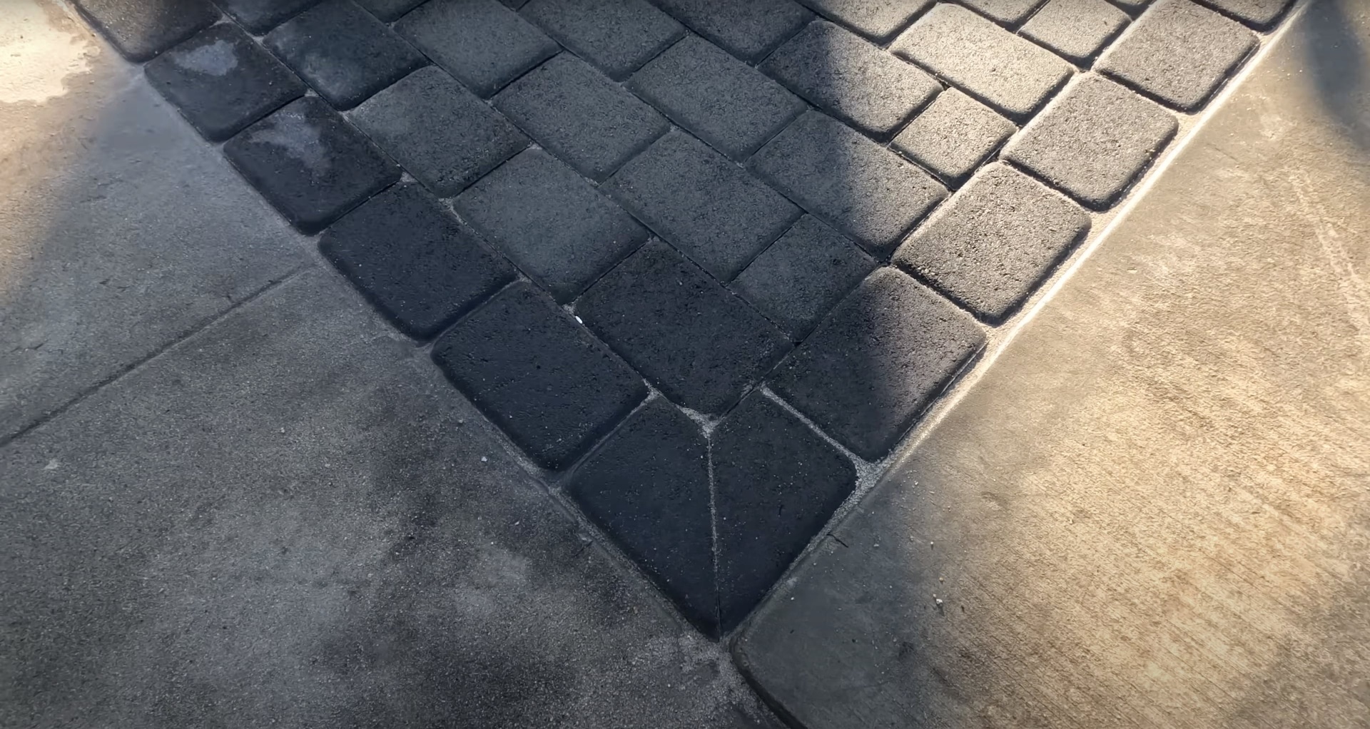 Detailed concrete paver pattern showing expert installation and finishing work